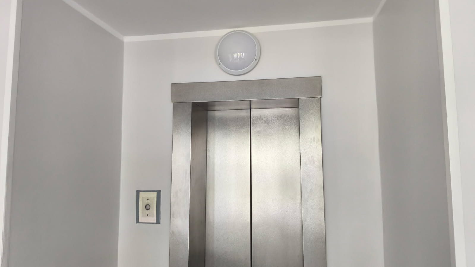Elevator area with renewed wall finish.