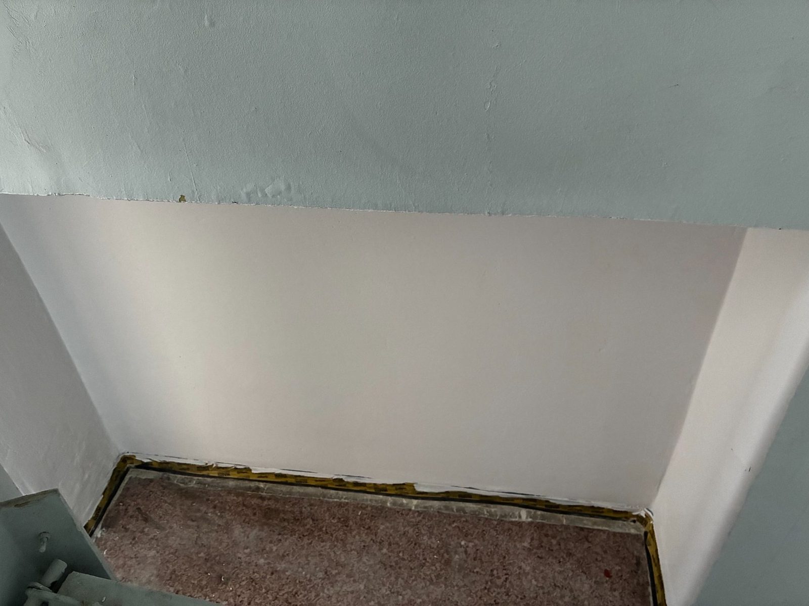 Clean repaired surface integrated into the existing wall zone.