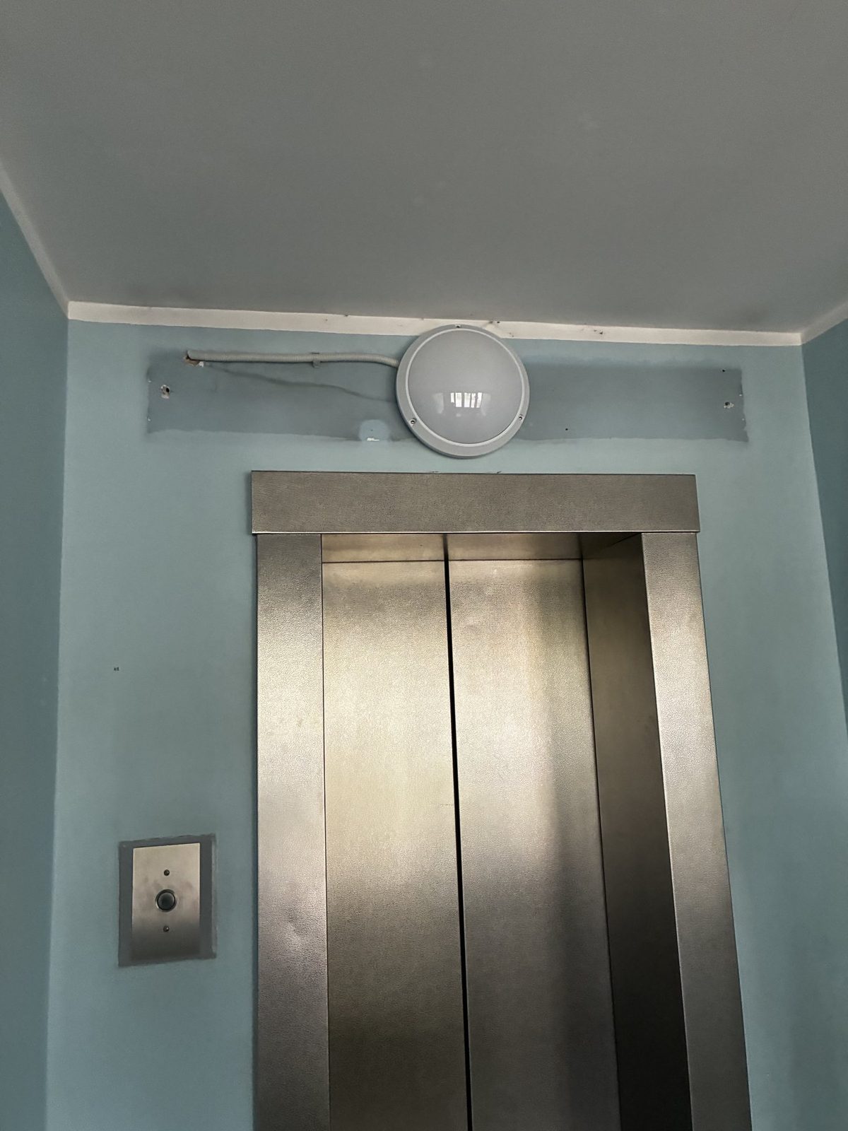 Elevator lobby before entrance-area refresh.