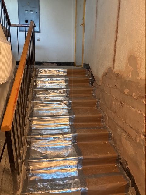 Stair flights protected during renovation works.