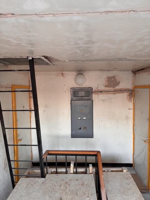 Stairwell wall and ceiling surfaces before finishing.