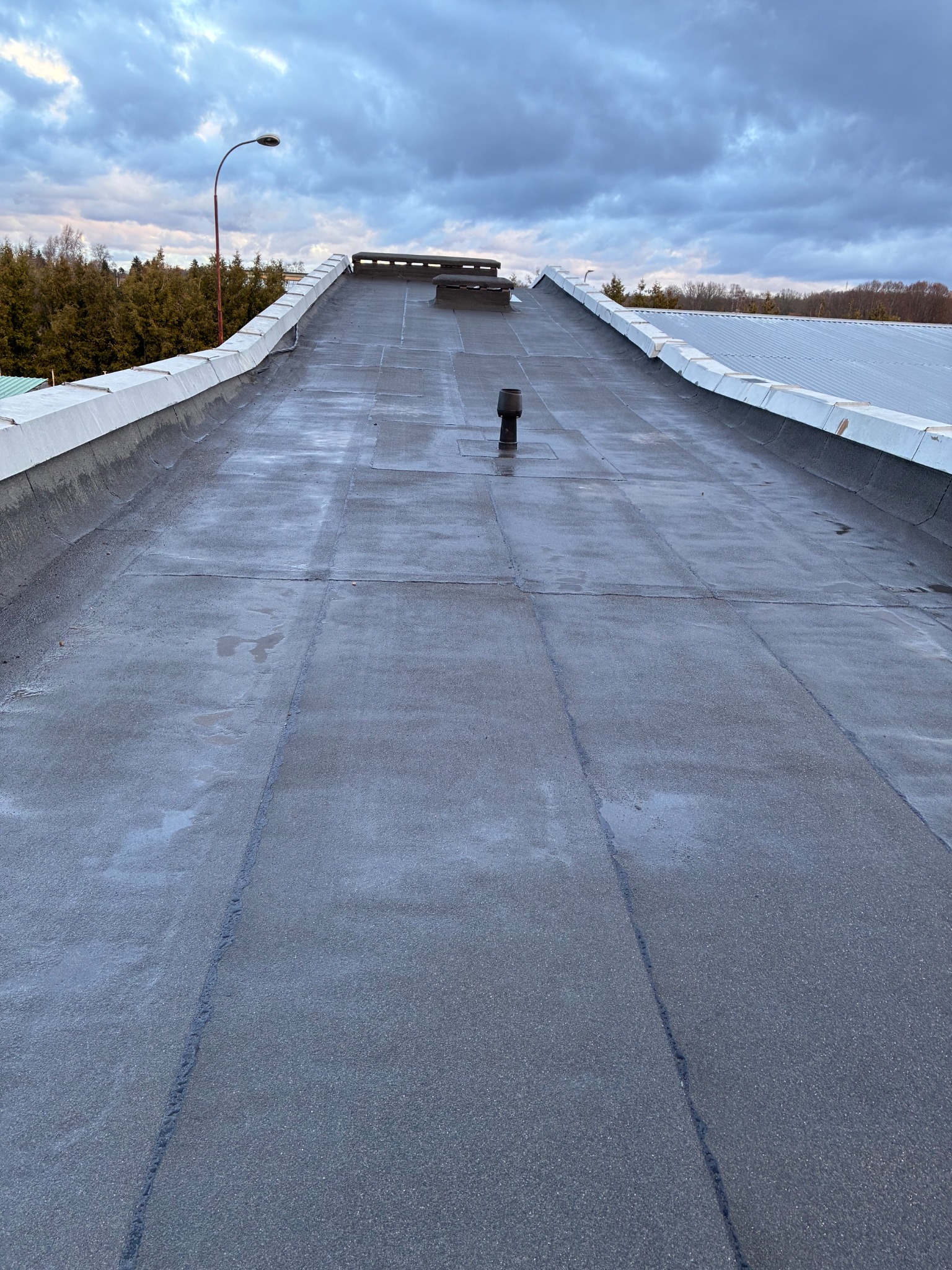 After renovation: completed roof at sunset
