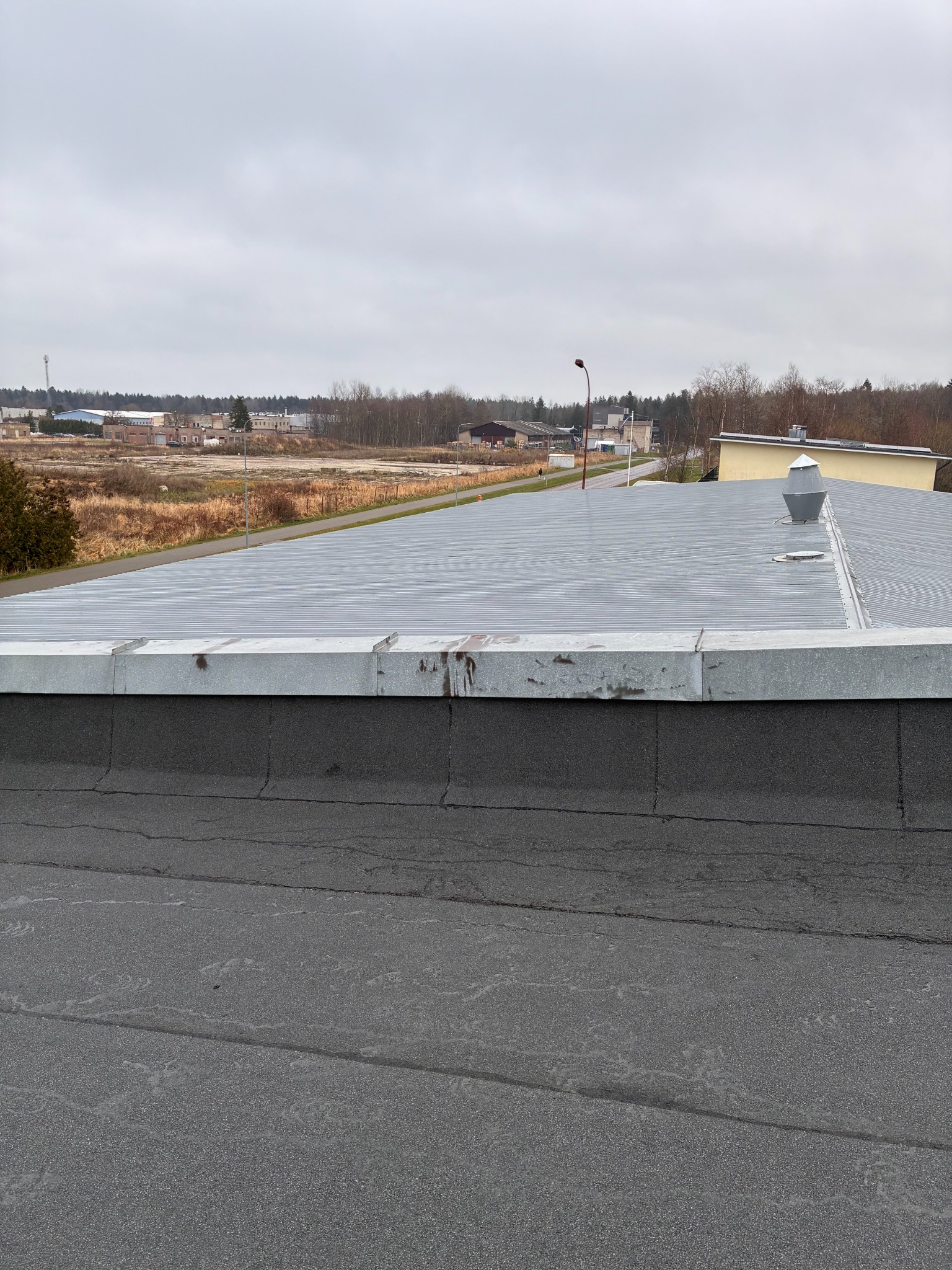 After renovation: completed parapet and roof curb