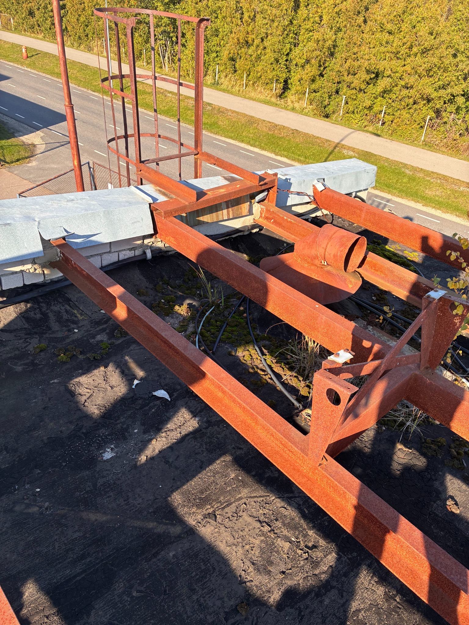 Before renovation: obsolete rusted steel structure on the roof