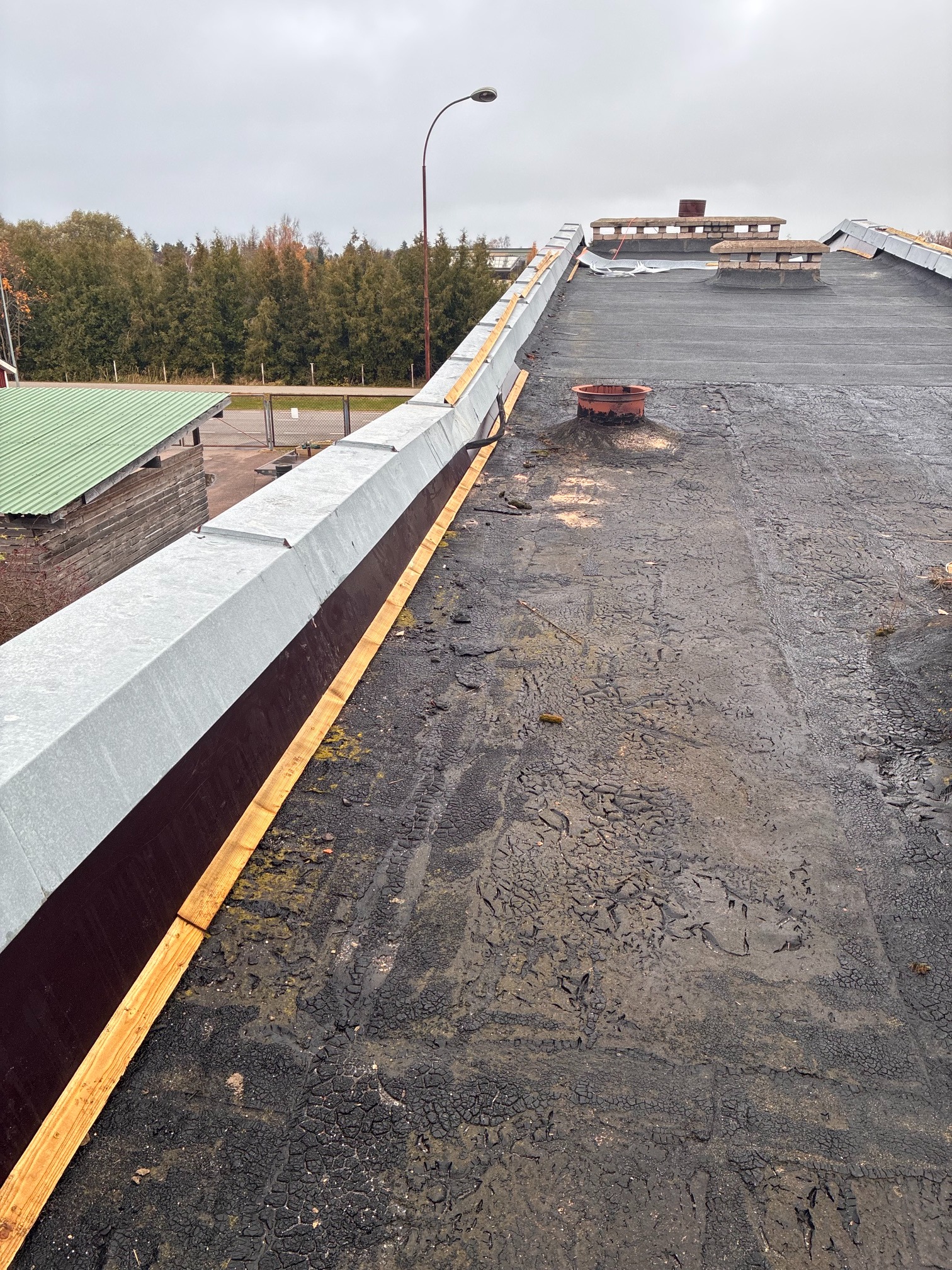 Roof renovation in progress: parapet rebuild and new timber support