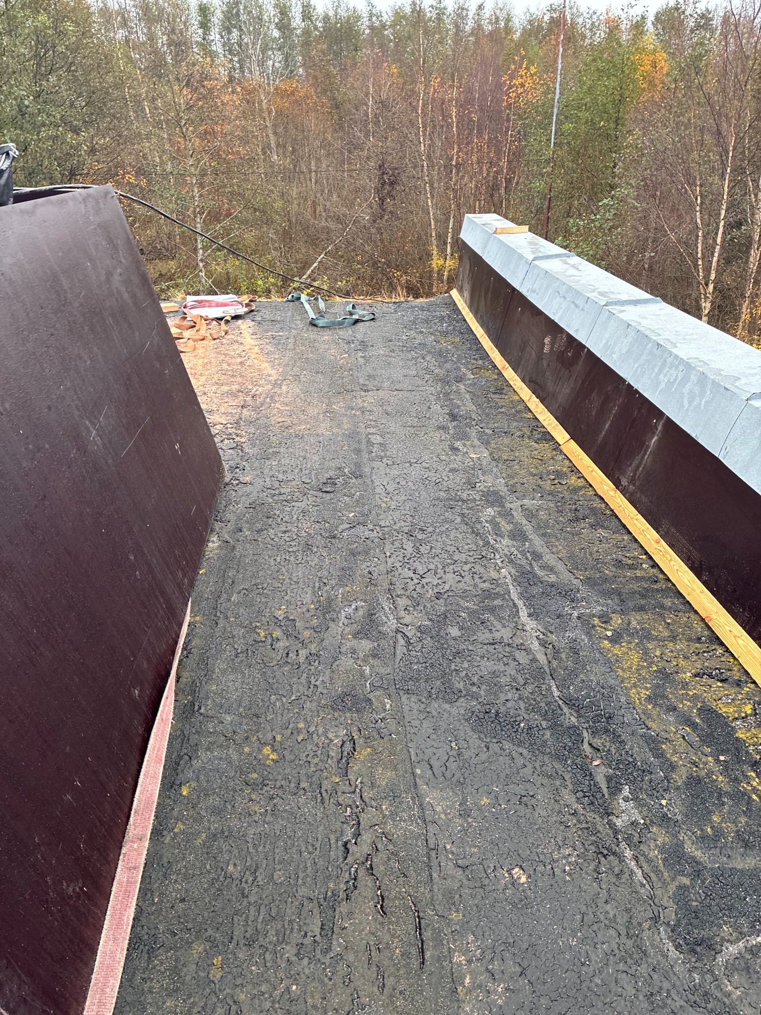 Roof renovation in progress: new parapet formwork and support